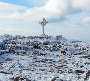 celtic cross atop snow