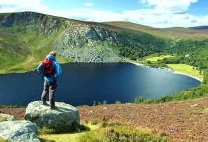 hiking man standing on mtn. point